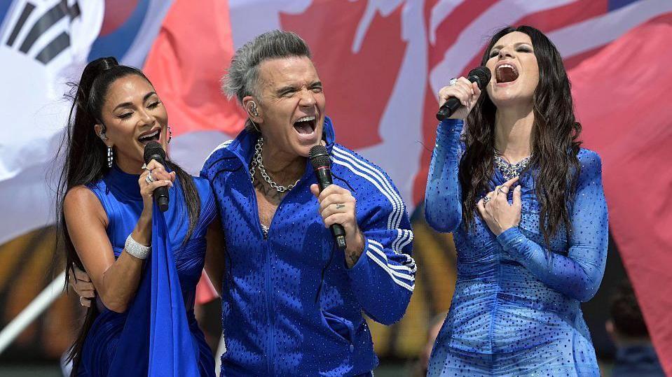 Robbie Williams, Tom Cruise and Jennifer Hudson at the World Cup closing ceremony